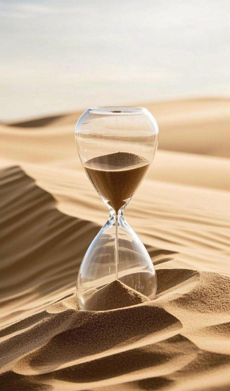 Hourglass on Desert Sand