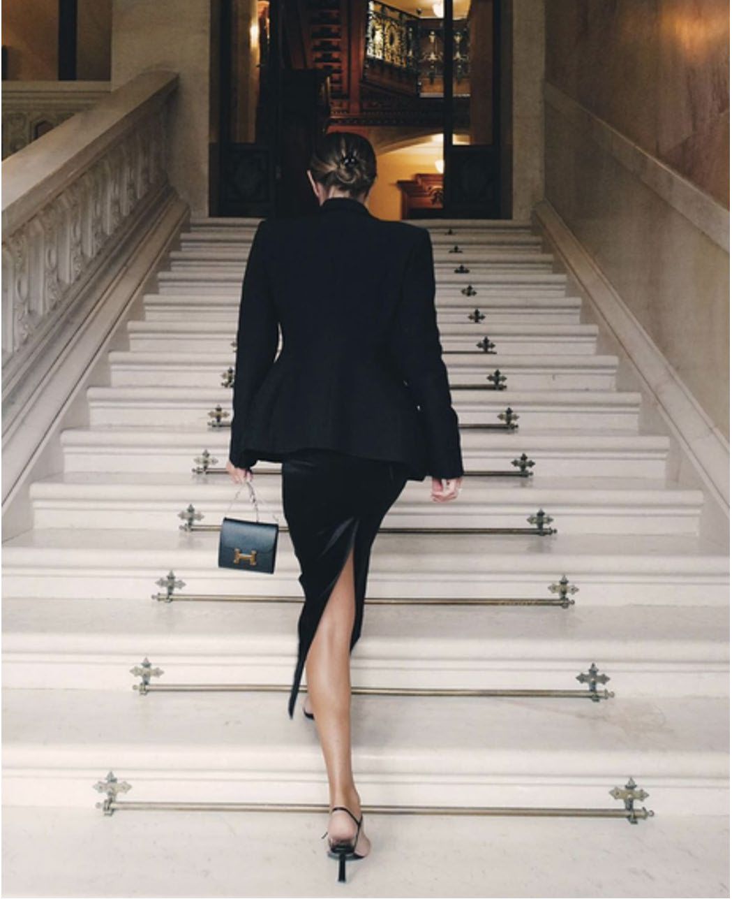 Hourglass Silhouette on Marble Stairs